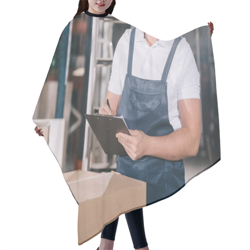 Personality  Cropped View Of Warehouse Worker Writing On Clipboard While Standing Near Cardboard Box Hair Cutting Cape