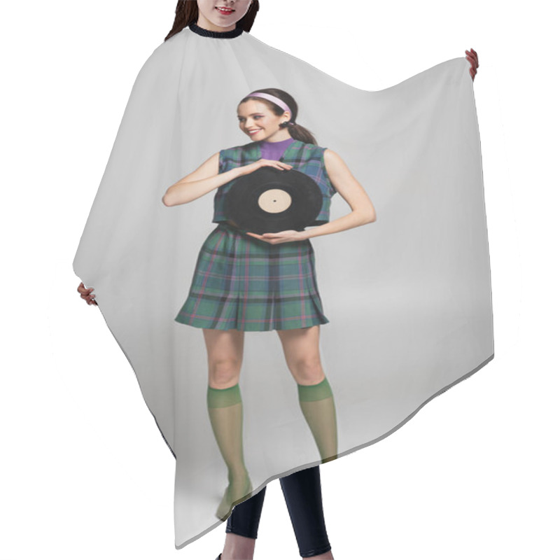 Personality  Full Length Of Happy Young Woman In Headband Holding Retro Vinyl Disc On Grey Hair Cutting Cape