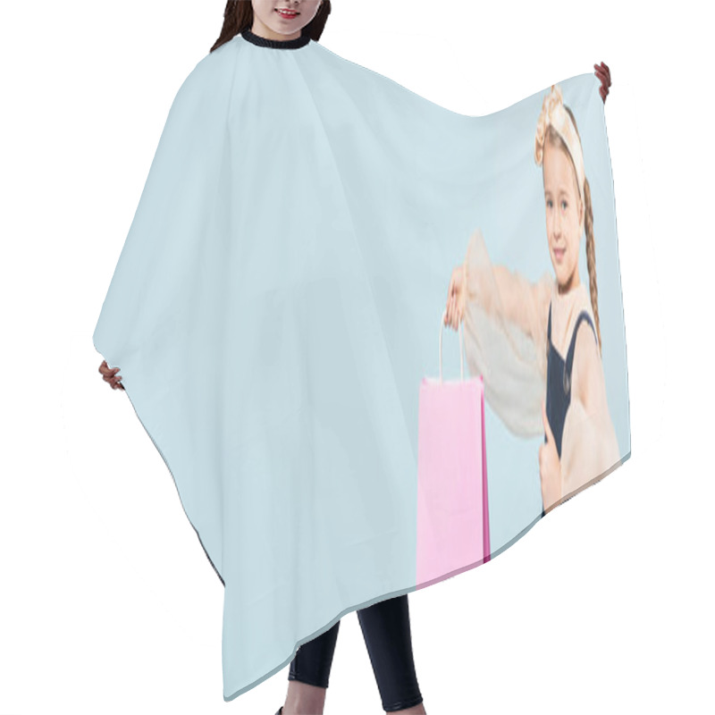 Personality  Happy Kid With Pigtails Holding Shopping Bag And Showing Thumb Up Isolated On Blue, Banner Hair Cutting Cape