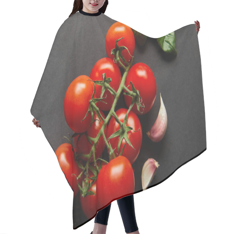 Personality  Top View Of Organic Cherry Tomatoes, Basil Leaves, Rosemary And Garlic Cloves On Black Hair Cutting Cape