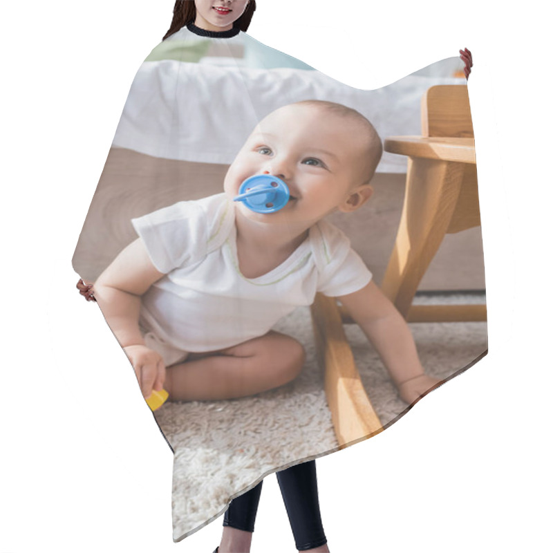 Personality  Cheerful Little Boy With Pacifier Holding Toy Building Block While Sitting On Floor Hair Cutting Cape