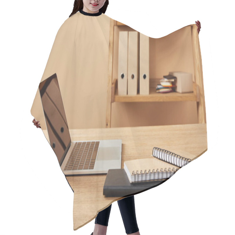 Personality  Laptop And Notebooks On Wooden Table At Home Hair Cutting Cape