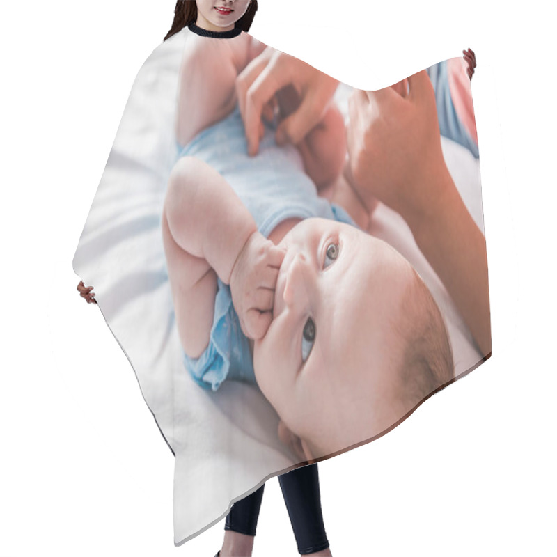 Personality  Cropped View Of Mother Holding Hand Of Infant Daughter Sucking Fingers  Hair Cutting Cape