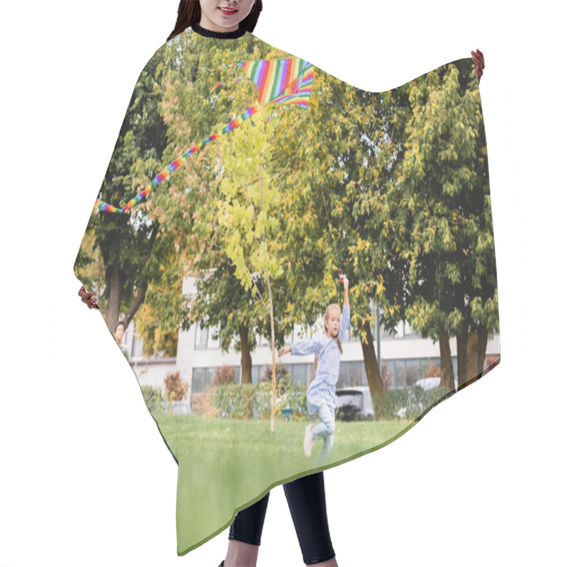 Personality  Kid Running With Flying Kite Near Friends On Blurred Background On Meadow In Park  Hair Cutting Cape