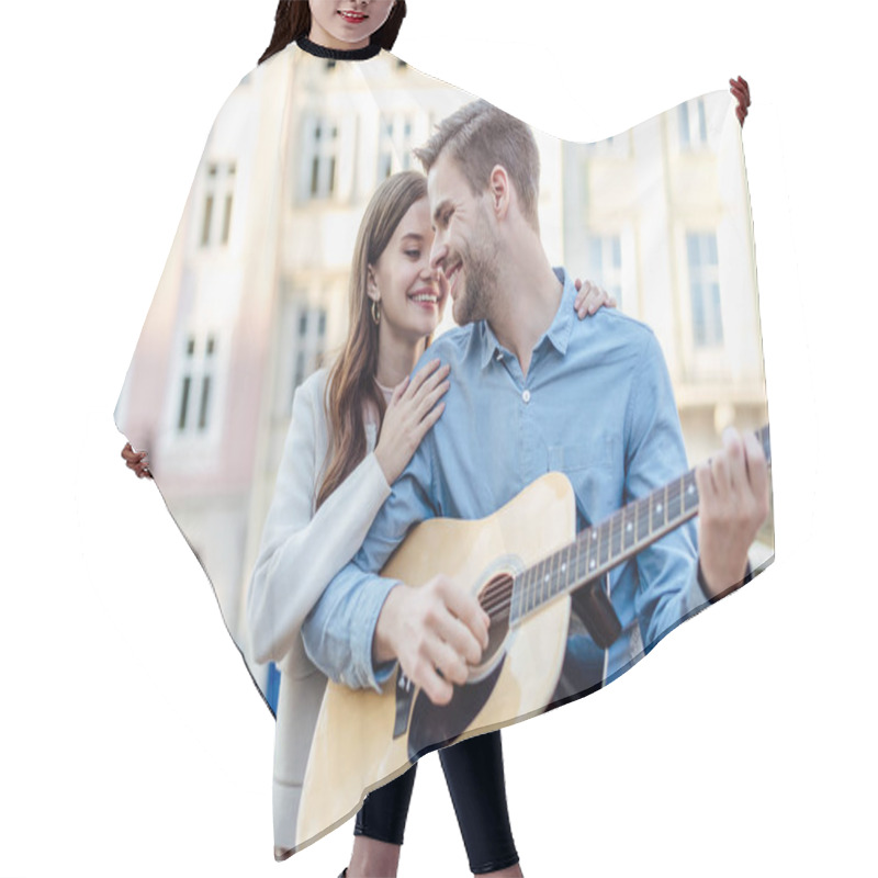 Personality  Handsome Man Playing Acoustic Guitar Near Happy Girlfriend On Street Hair Cutting Cape