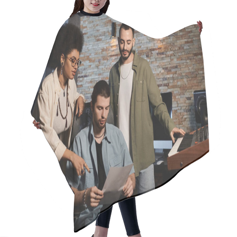 Personality  Three Individuals In A Recording Studio Scrutinizing A Sheet Of Music. Hair Cutting Cape