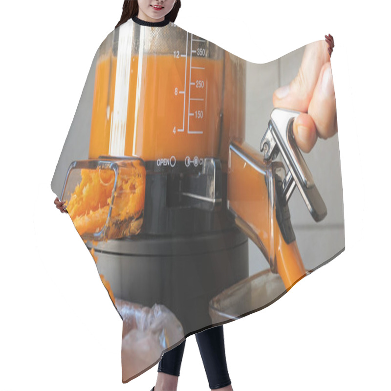 Personality  Slow Juicer Is Making Fresh Carrot And Orange Juice. Hair Cutting Cape