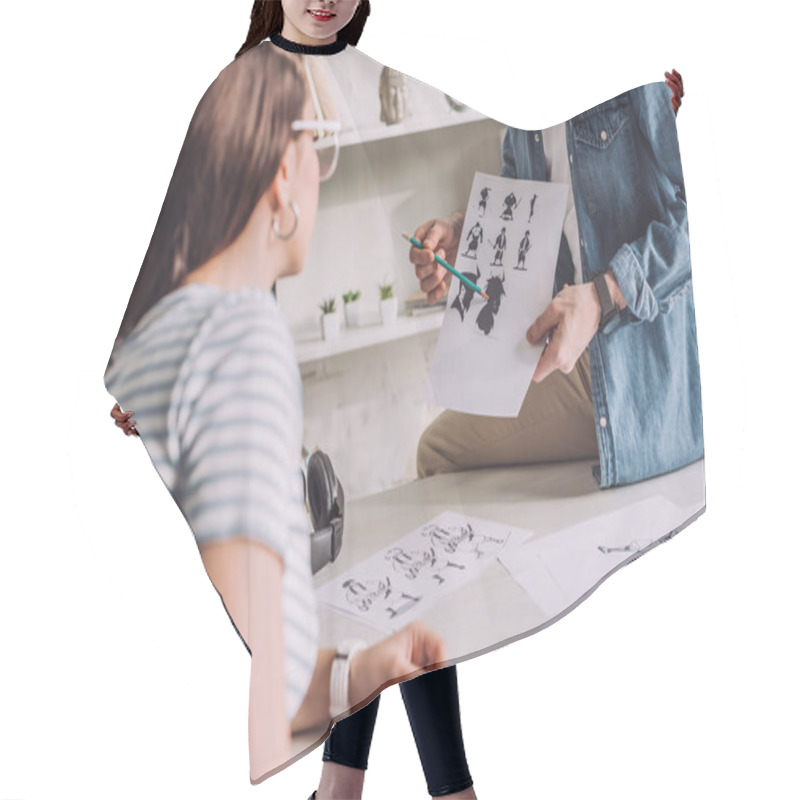 Personality  Cropped View Of Illustrator Holding Cartoon Sketches Near Woman  Hair Cutting Cape