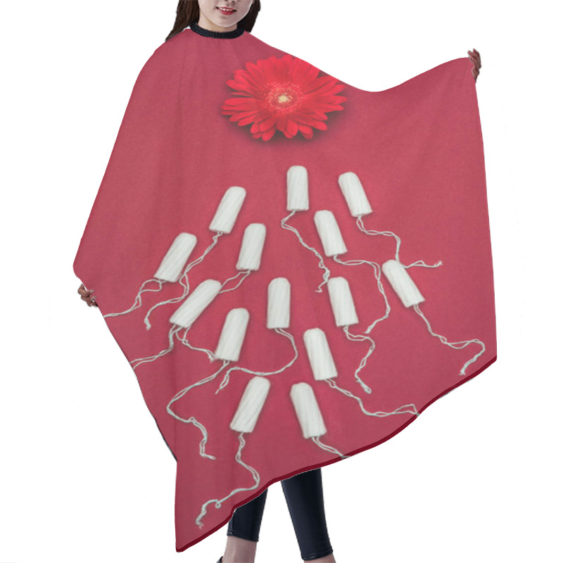 Personality  Top View Of Arranged Menstrual Tampons And Flower Isolated On Red Hair Cutting Cape