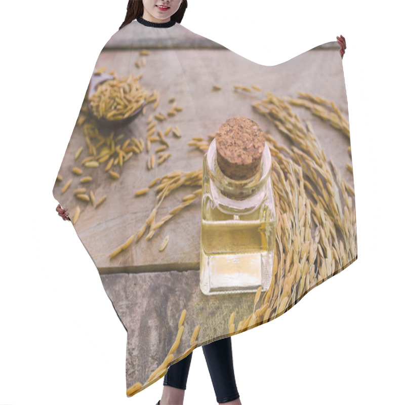 Personality  Rice Bran Oil On Wooden Background. Food And Healthcare Concept. Hair Cutting Cape