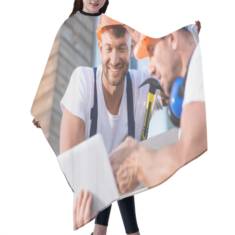 Personality  Selective Focus Of Handymen Using Digital Tablet On Roof Of Building  Hair Cutting Cape