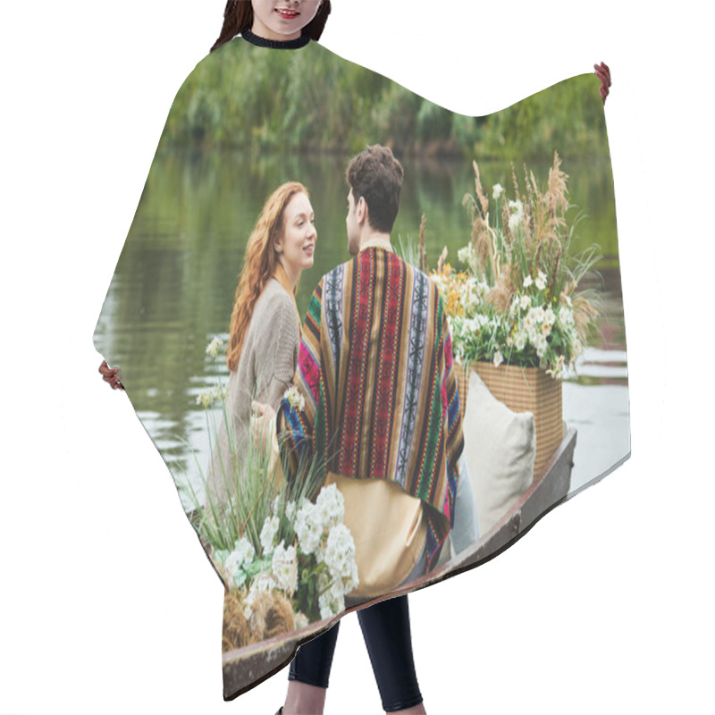 Personality  A Man And Woman In Boho Attire Sail In A Boat Surrounded By Blooming Flowers, Enjoying A Romantic Date In A Green Park. Hair Cutting Cape