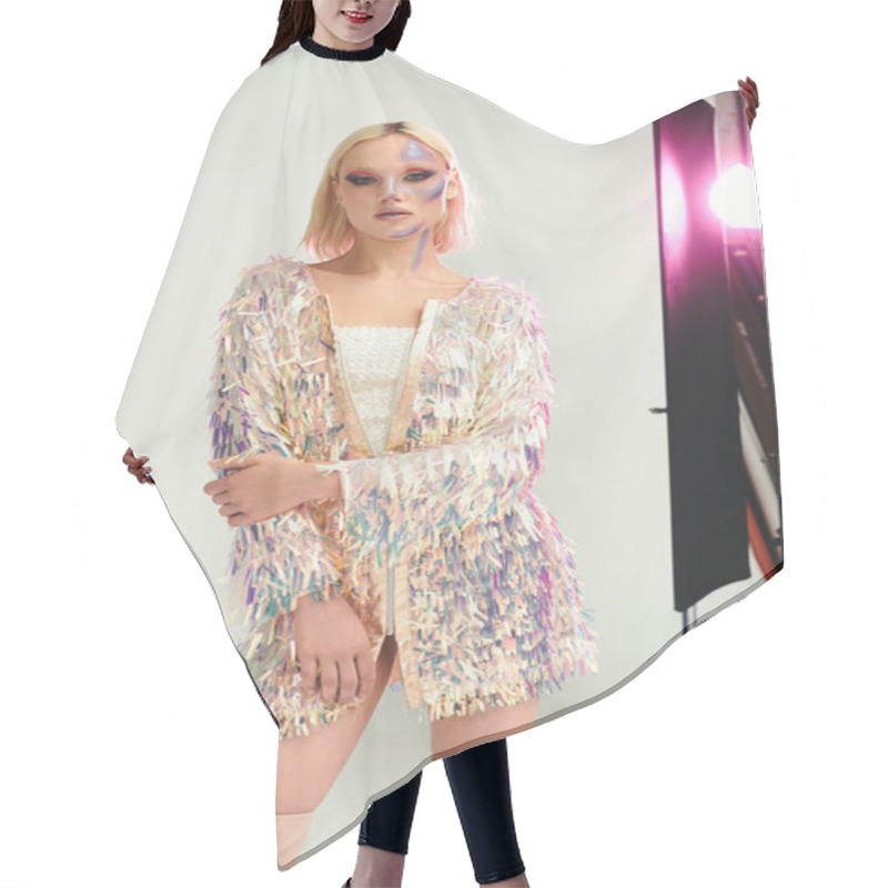 Personality  A Young Woman Poses Confidently In Holographic Attire With Creative Lighting. Hair Cutting Cape