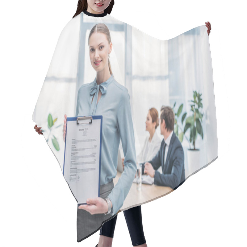 Personality  Selective Focus Of Happy Recruiter Holding Clipboard With Resume Cv Lettering Near Coworkers  Hair Cutting Cape