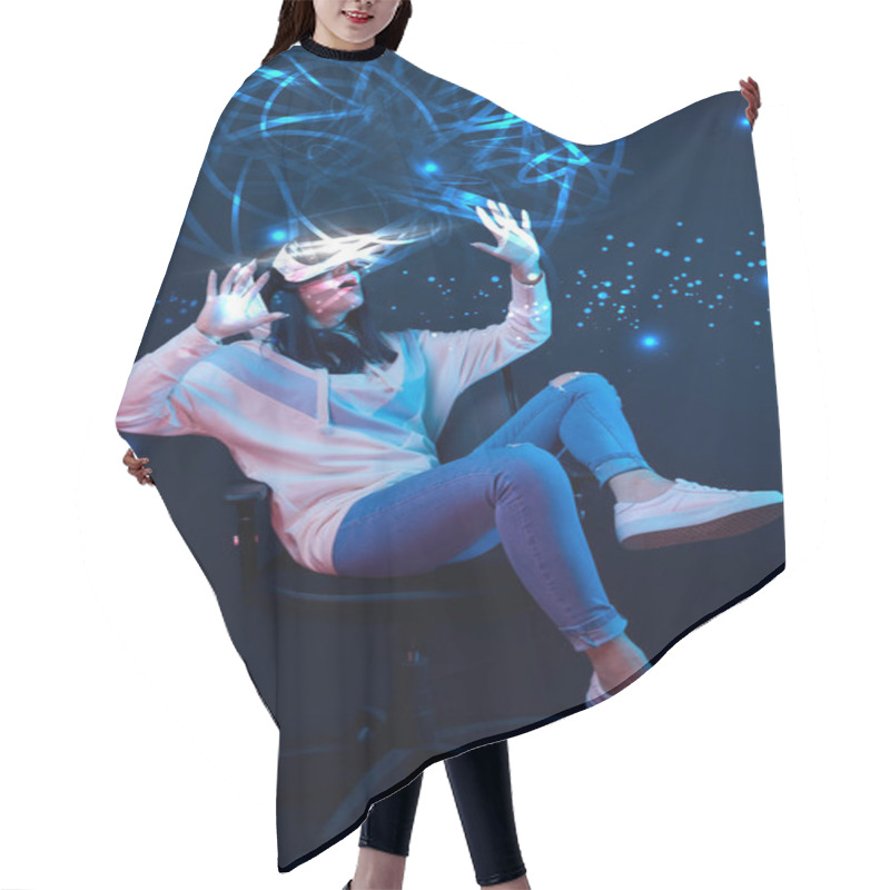 Personality  Young Shocked Woman In Virtual Reality Headset Sitting On Chair And Gesturing Among Glowing Data Illustration On Dark Background  Hair Cutting Cape