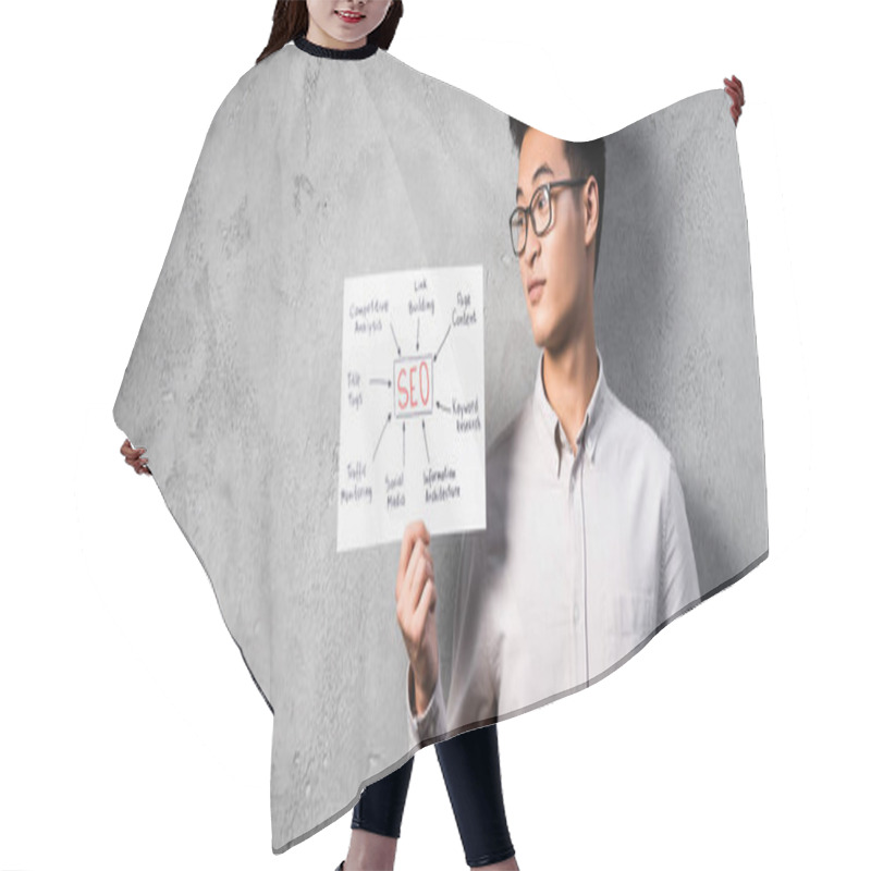 Personality  Panoramic Shot Of Asian Seo Manager Holding And Looking At Paper With Concept Words Of Seo  Hair Cutting Cape