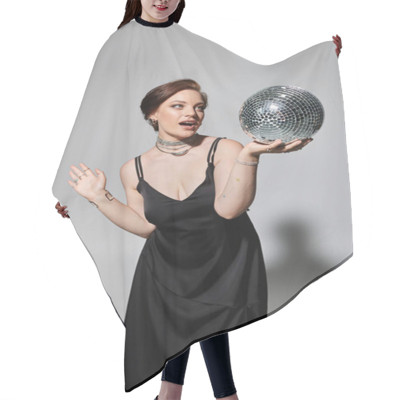 Personality  A Young Woman Dressed In Elegant Attire Expertly Holds And Poses With A Shimmering Disco Ball. Hair Cutting Cape