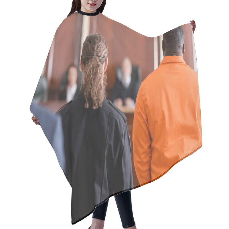 Personality  Back View Of Accused African American Man Near Guard And Blurred Jurors In Courtroom Hair Cutting Cape