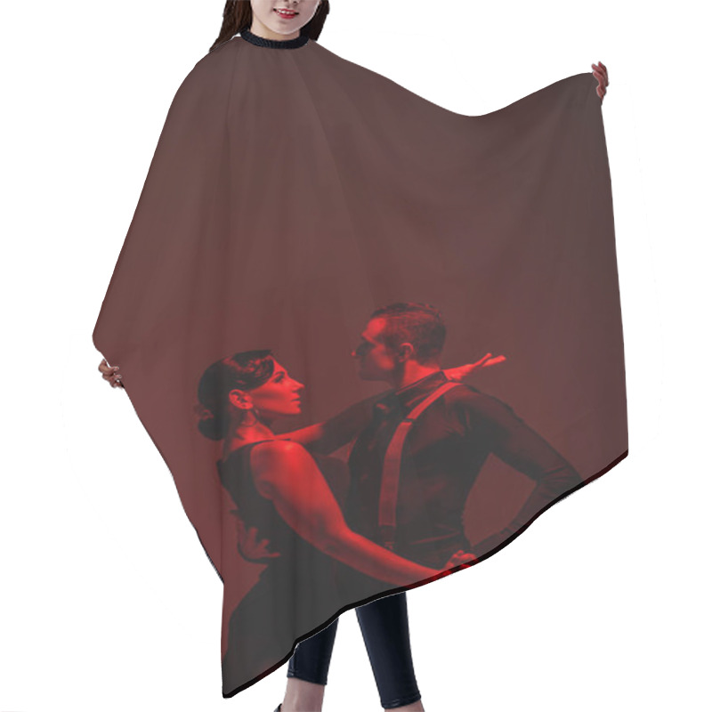 Personality  Sensual Couple Of Dancers Performing Tango On Dark Background With Red Illumination Hair Cutting Cape