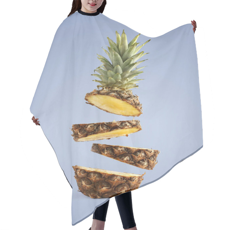 Personality  Pineapple Sliced, Levitates In The Air. Concept Of Summer Mood On A Blue Background. Hair Cutting Cape