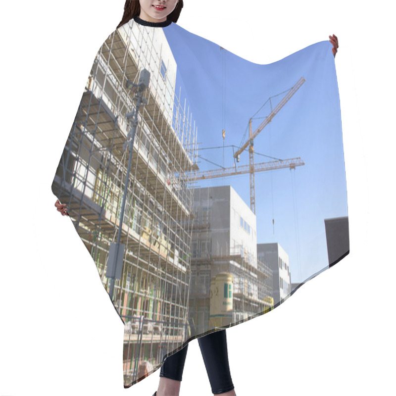 Personality  Nijmegen, Netherlands - February 8, 2023: Construction Site With Buildings Under Construction With A Clear Blue Sky Hair Cutting Cape