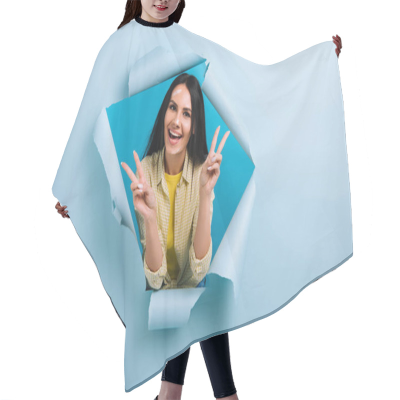 Personality  Excited Workwoman With Dirty Face In Paint Showing Victory Signs In Torn Paper, Isolated On Blue Hair Cutting Cape