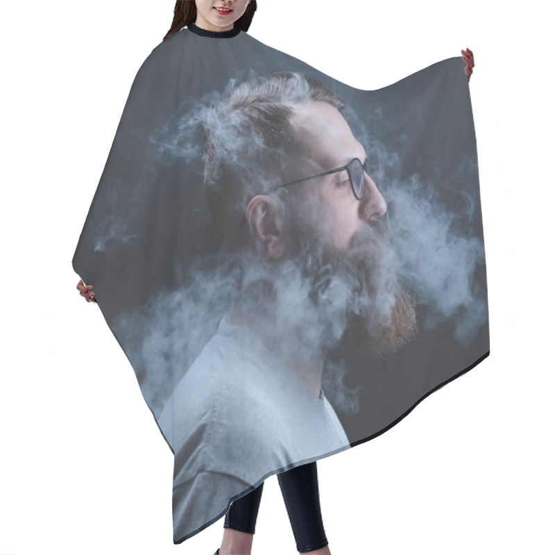 Personality  Concept. Smoke Enveloped The Head Man. Portrait Of A Bearded, Stylish Man With Smoke. Secondhand Smoke. Hair Cutting Cape