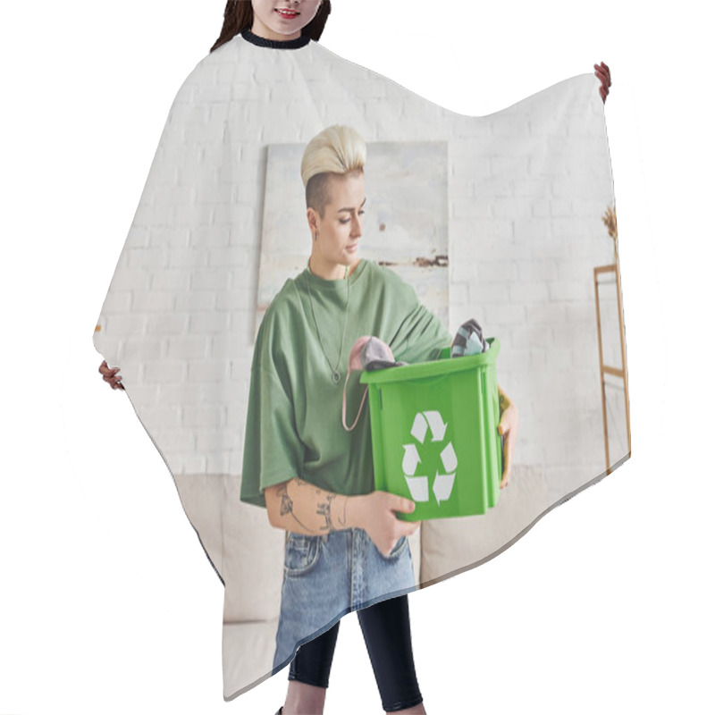 Personality  Eco-conscious Lifestyle, Young And Tattooed Woman With Trendy Hairstyle Holding Green Recycling Box With Clothing, Sustainable Living And Environmentally Friendly Habits Concept Hair Cutting Cape