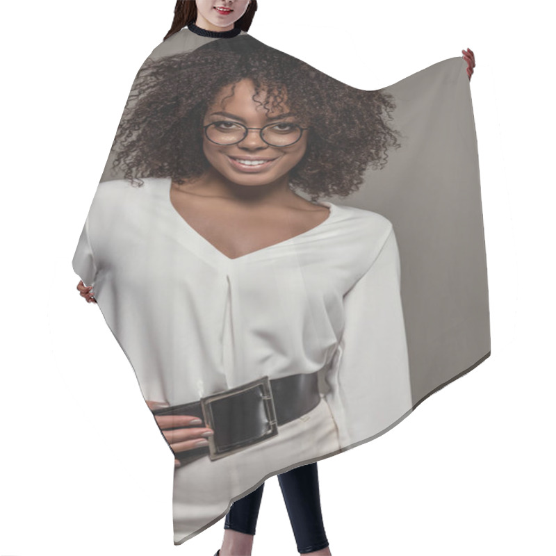 Personality  Young Smiling African American Woman In White Shirt Wearing Glasses And Hat Isolated On Grey Background Hair Cutting Cape