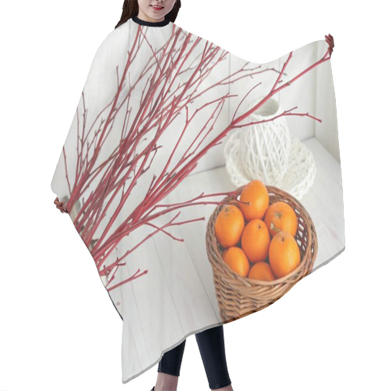 Personality  A Photo Featuring A Still Life Composition With A Focus On A Brown Woven Basket Filled With Small, Round, Vibrant Orange-colored Oranges And A Branch Of Long, Thin, Reddish-brown Twigs. The Setting Is A Room With A White Wooden Wall In The Background Hair Cutting Cape