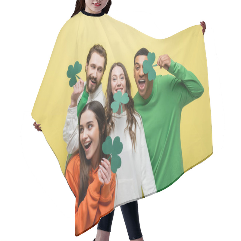 Personality  Cheerful Interracial Friends Holding Paper Clover Isolated On Yellow  Hair Cutting Cape