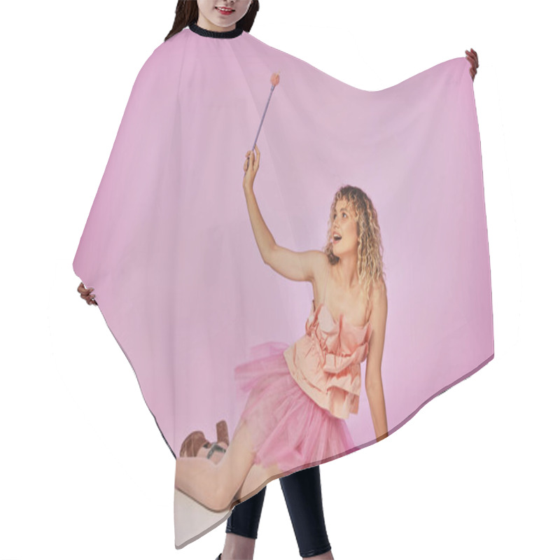 Personality  Cheerful Blonde With Curly Hair Posing On Pink Backdrop In Tooth Fairy Costume With Magic Wand Hair Cutting Cape