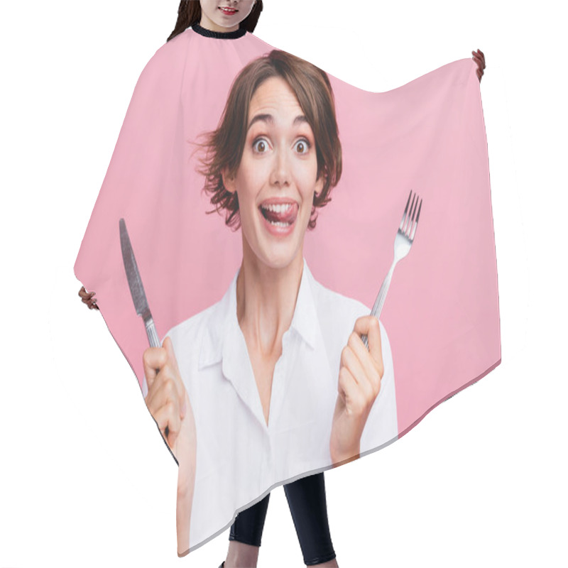 Personality  Photo Of Pretty Charming Toothy Girl Licks Her Teeth She Is Hungry Waiting Eating Using Fork And Knife Isolated On Pink Color Background. Hair Cutting Cape