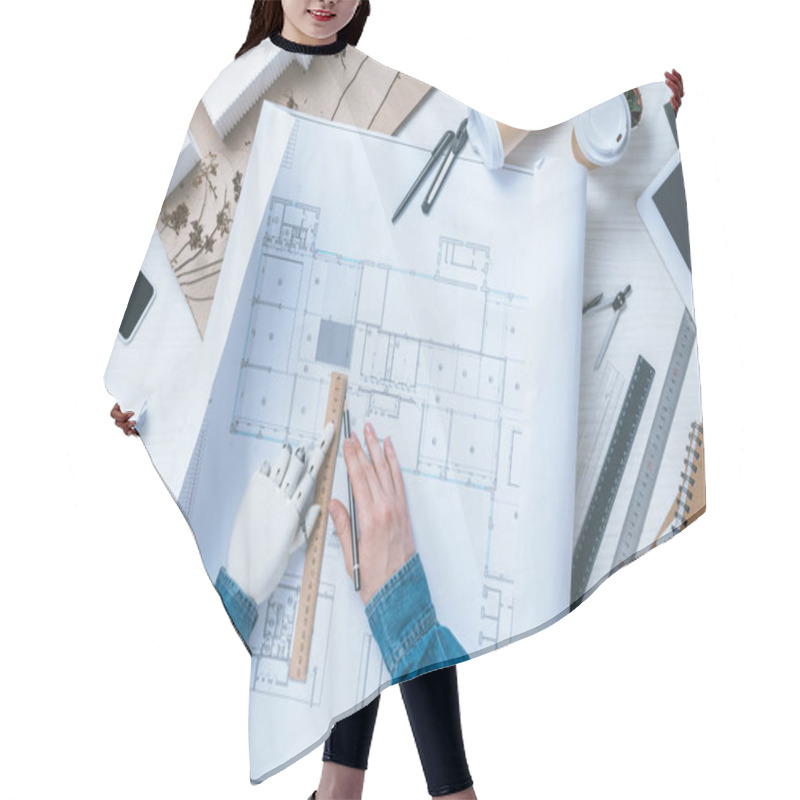 Personality  Cropped Image Of Male Architect With Prosthetic Arm Drawing On Blueprint At Table  Hair Cutting Cape