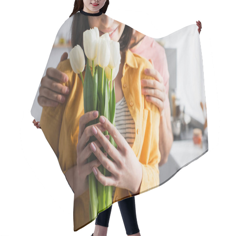 Personality  Partial View Of Young Man Hugging Girlfriend With Bouquet Of Flowers In Kitchen Hair Cutting Cape