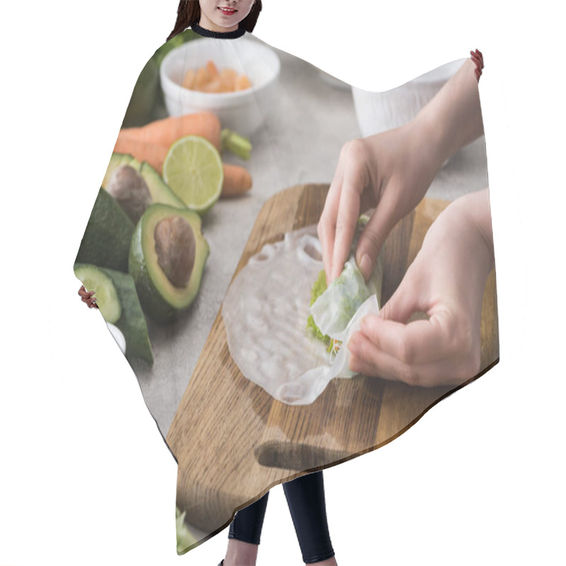 Personality  Cropped View Of Woman Making Spring Roll On Cutting Board  Hair Cutting Cape