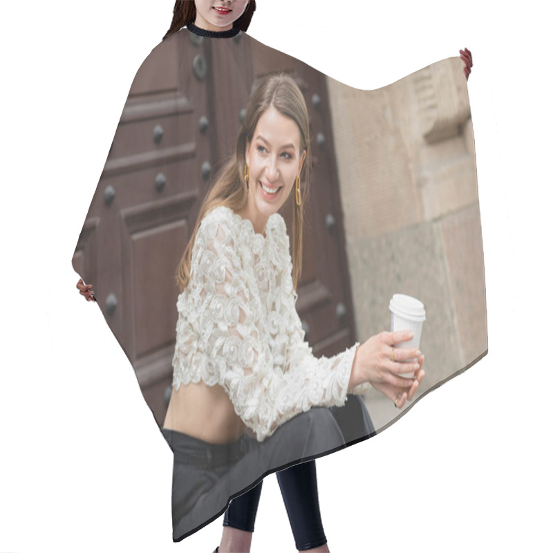 Personality  Happy Stylish Woman Holding Coffee To Go While Sitting On Stairs Near Door In Berlin, Germany  Hair Cutting Cape