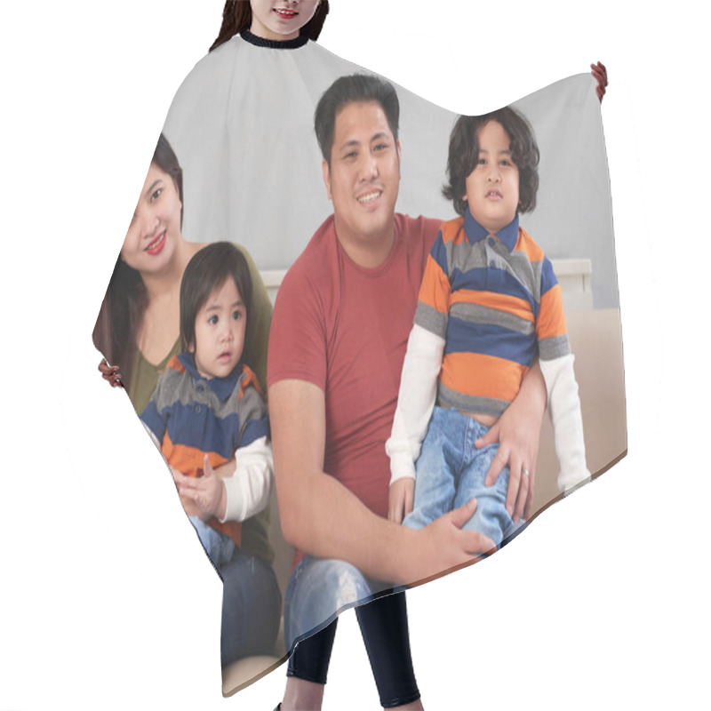 Personality  Happy Filipino Family Of Four Sitting On Sofa Hair Cutting Cape