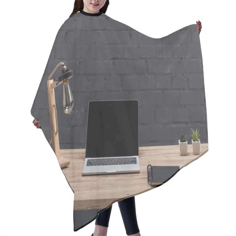 Personality  Modern Workplace With Laptop With Blank Screen, Decor, Lamp And Notebook On Wooden Table Near Black Brick Wall Hair Cutting Cape