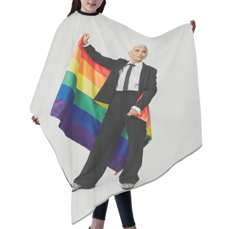 Personality  Confident Woman With Short Hair Proudly Holding A Rainbow Flag. Hair Cutting Cape