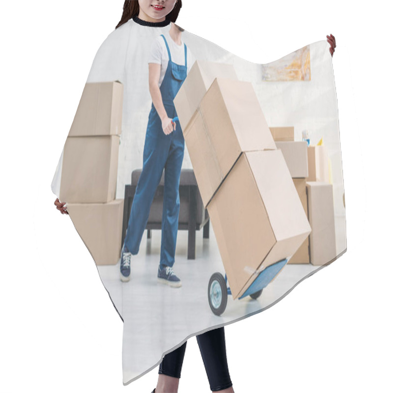 Personality  Cropped View Of Mover In Uniform Transporting Cardboard Boxes On Hand Truck In Apartment Hair Cutting Cape