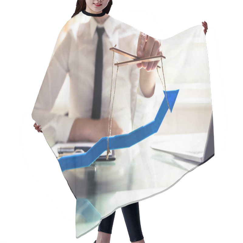 Personality  Businessperson's Hand Manipulating Blue Arrow With Rope Hair Cutting Cape