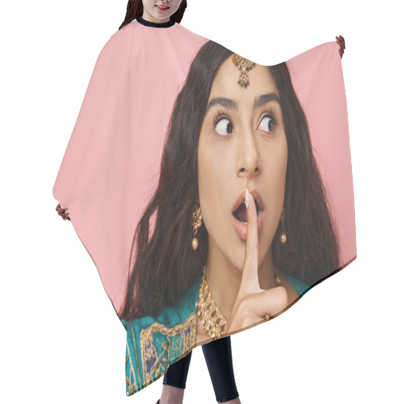 Personality  Shocked Young Indian Woman In Traditional Costume Posing With Finger Near Mouth On Pink Backdrop Hair Cutting Cape