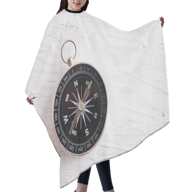 Personality  Compass On The White Wooden Table Background, Concept For Direction, Travel, Guidance Or Assistance Hair Cutting Cape