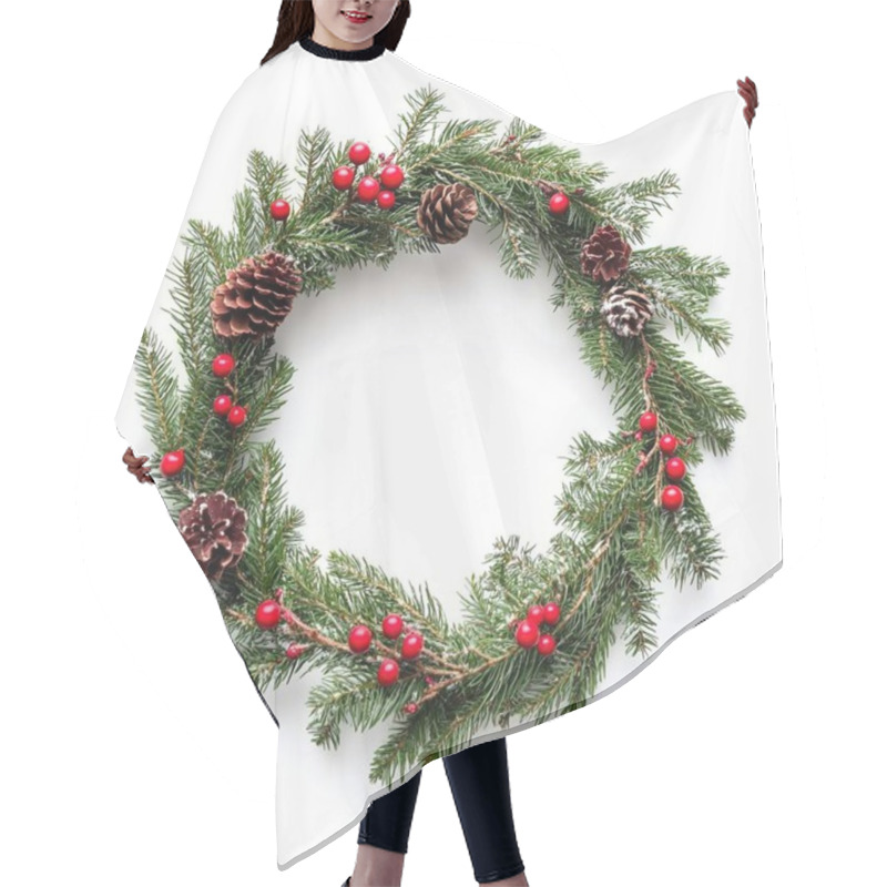 Personality  Decorative Christmas Wreath With Pine Cones And Red Berries On A White Background. Hair Cutting Cape