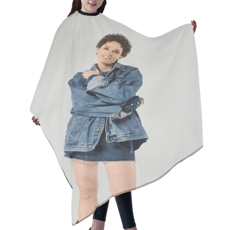 Personality  A Young Woman Displays Her Style In A Trendy Denim Outfit, Striking A Playful Pose. Hair Cutting Cape