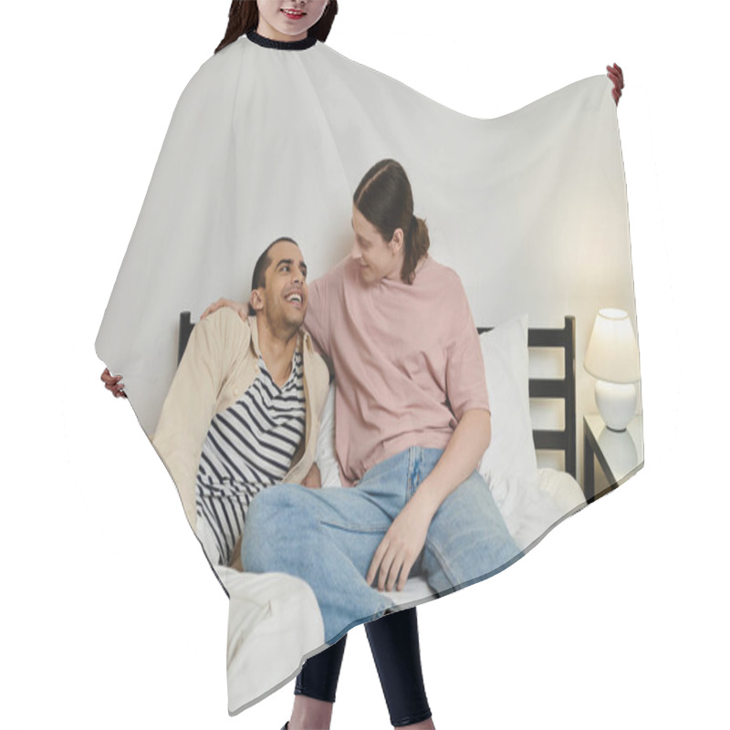 Personality  A Young Gay Couple In Casual Attire Shares A Laugh And A Comfortable Moment Together On A Bed In A Modern Apartment. Hair Cutting Cape