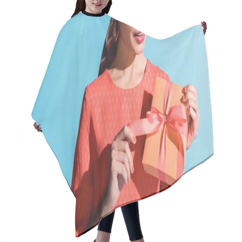 Personality  Cropped View Of Fashionable Woman In Living Coral Dress Holding Gift Box Isolated On Blue Hair Cutting Cape