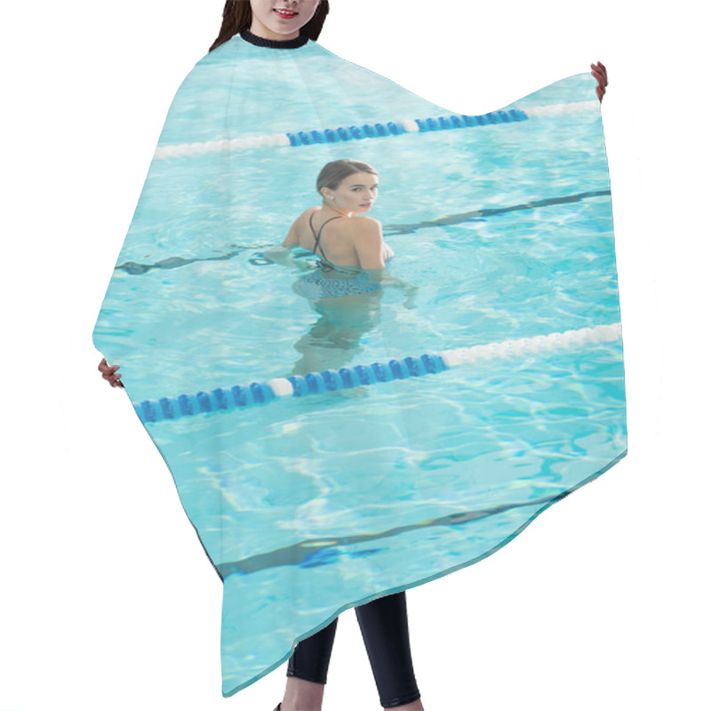 Personality  Back View Of Young Woman Looking At Camera In Swimming Pool  Hair Cutting Cape