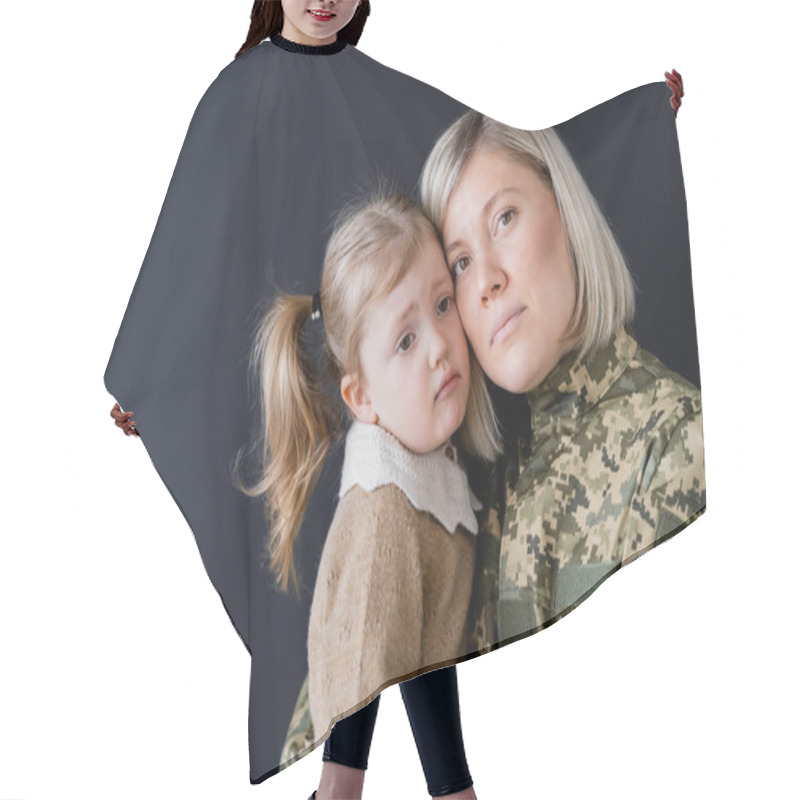 Personality  Woman In Camouflage Looking At Camera Near Upset Daughter Isolated On Black Hair Cutting Cape